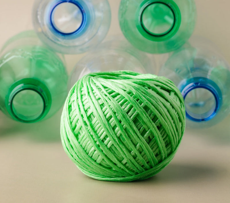 Green yarn made from recycled plastic bottles.