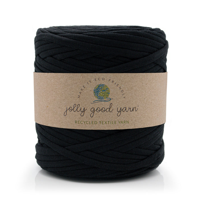 A large skein of black jolly good yarn with a brown kraft paper label, shown on a clean white background.
