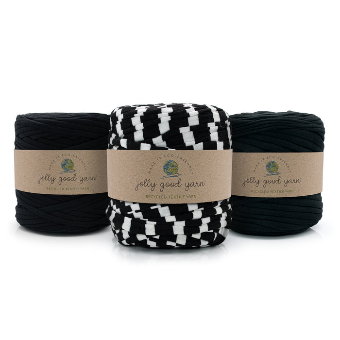 Three skeins of braided yarn from Jolly Good Yarn on a white background: two black, one black and white checkered.