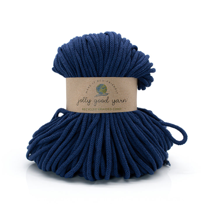 Blue yarn ball with a 'jolly good yarn' label on a white background