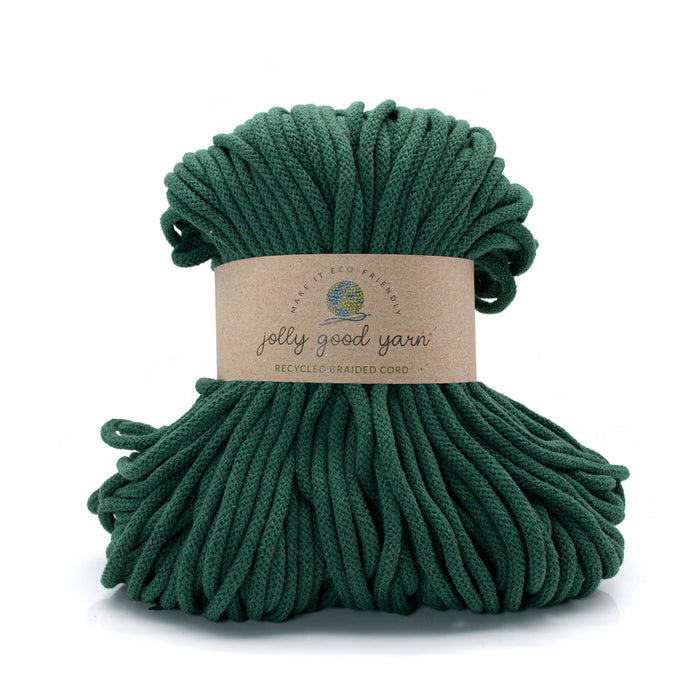 Green yarn ball with a label on a white background