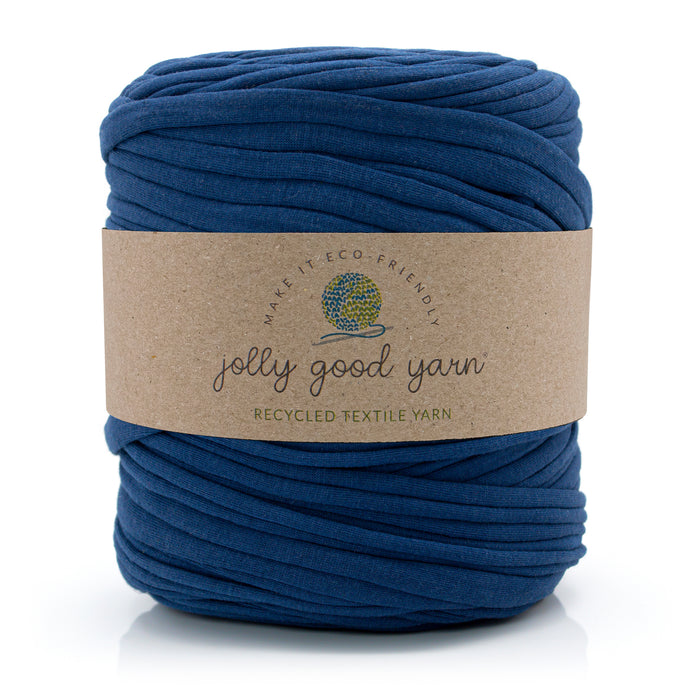A skein of deep blue recycled textile yarn wrapped in a brown kraft paper label that reads 'jolly good yarn'.