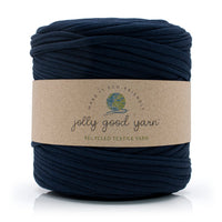 Dark blue yarn ball with a 'jolly good yarn' label on a white background