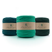 Three skeins of dark green T-Shirt yarn with 'jolly good yarn' labels on a white background