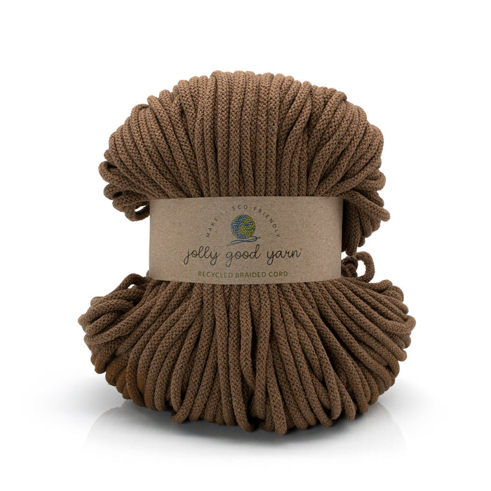 Brown yarn ball with a label on a white background