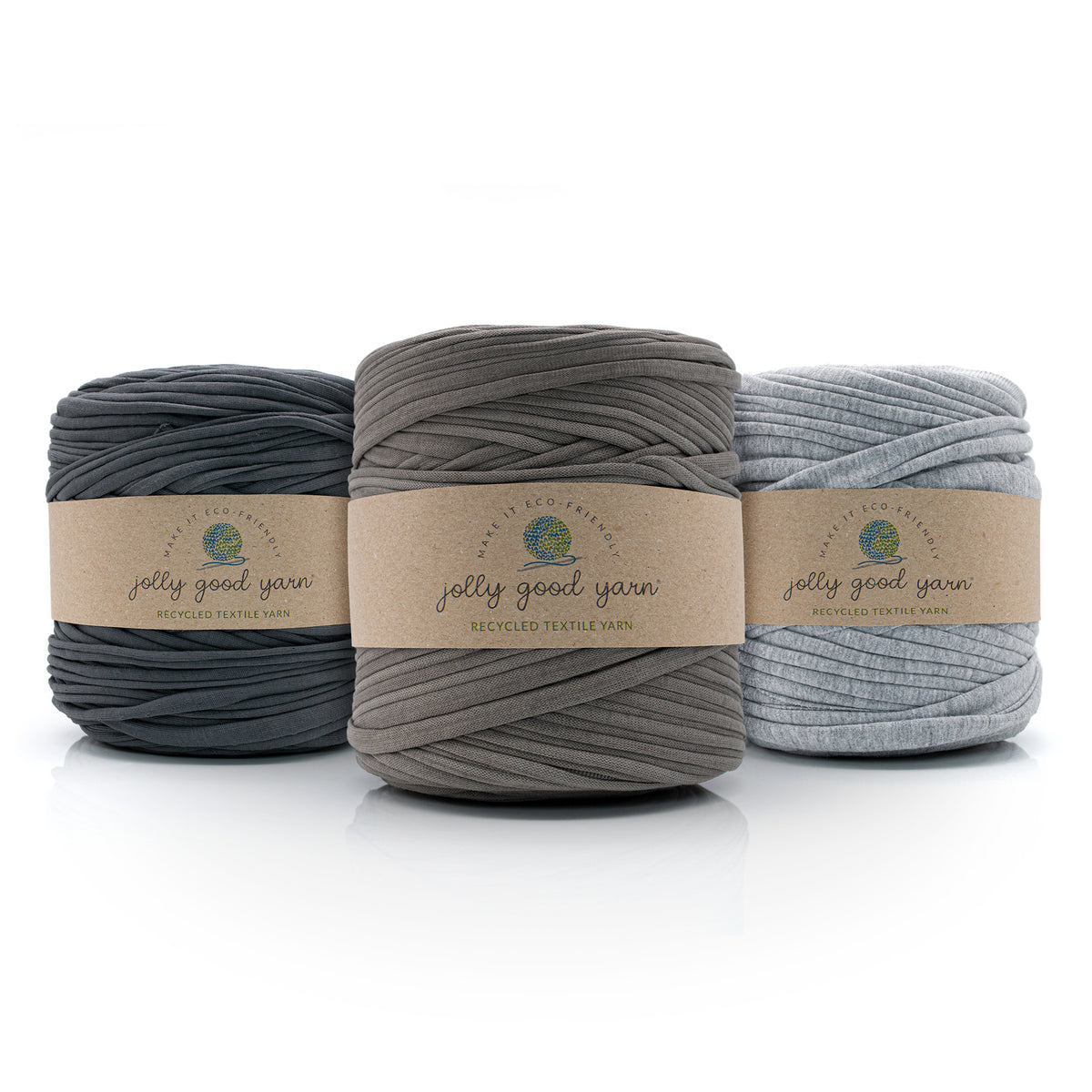 Three balls of T-Shirt yarn in grey shades with 'jolly good yarn' labels on a white background