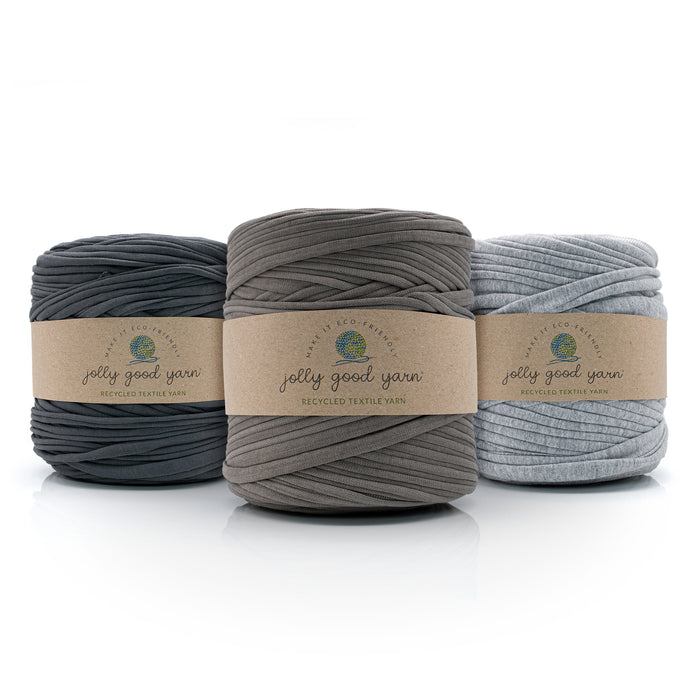 Three balls of T-Shirt yarn in grey shades with 'jolly good yarn' labels on a white background
