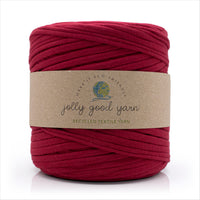 Red skein of yarn with a 'jolly good yarn' label on a white background