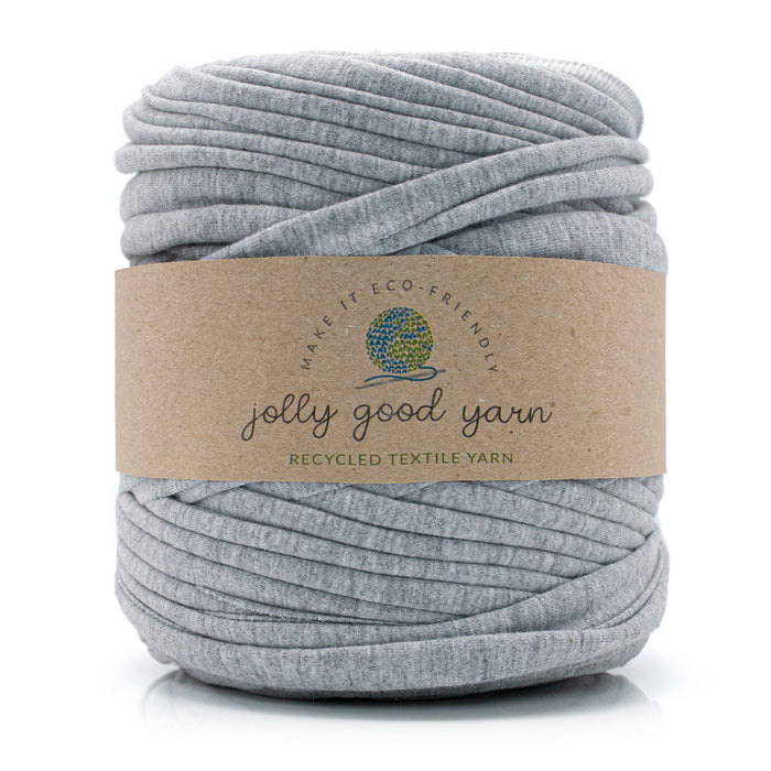 Ball of light grey t-shirt yarn with a 'jolly good yarn' label on a white background