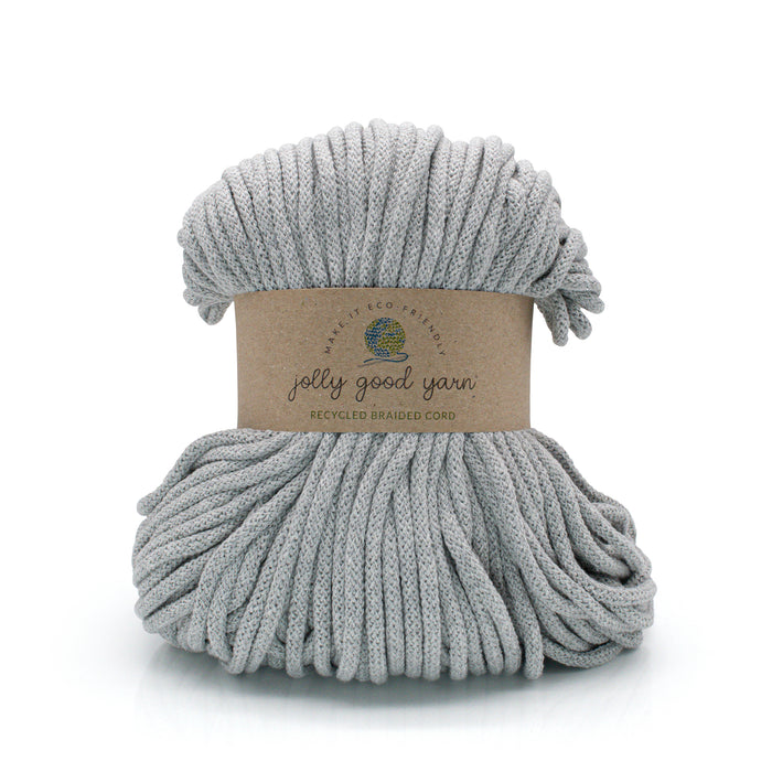 A skein of light gray braided cord with a brown paper label reading 'Jolly Good Yarn' and 'Recycled Bamboo Cord' on a white background.