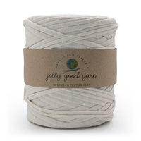Ball of recycled cream textile yarn with a brown label on a white background.