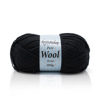 Black yarn ball with a label on a white background