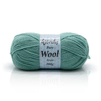 Ball of green yarn with a label on a white background