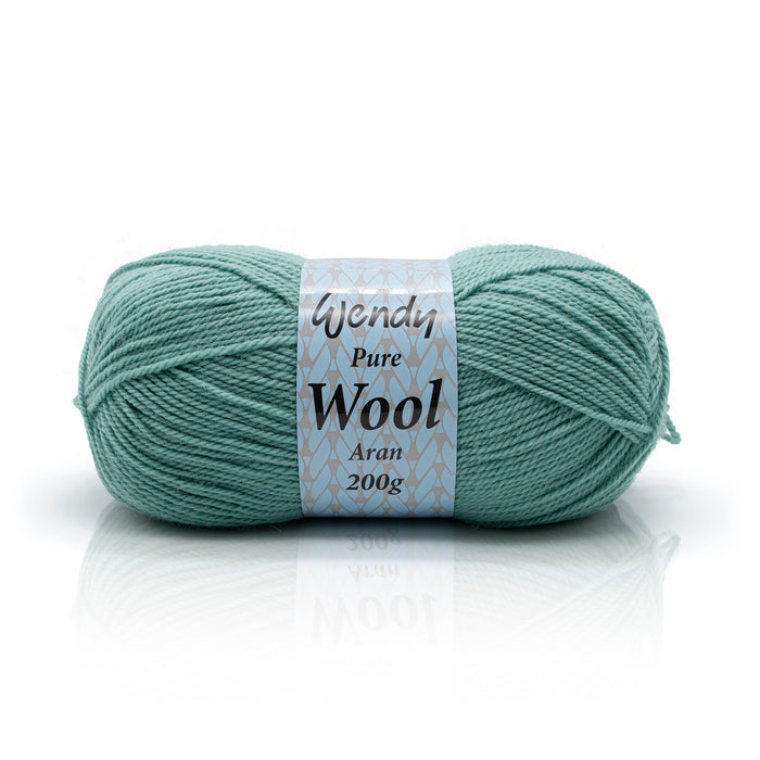 Ball of green yarn with a label on a white background