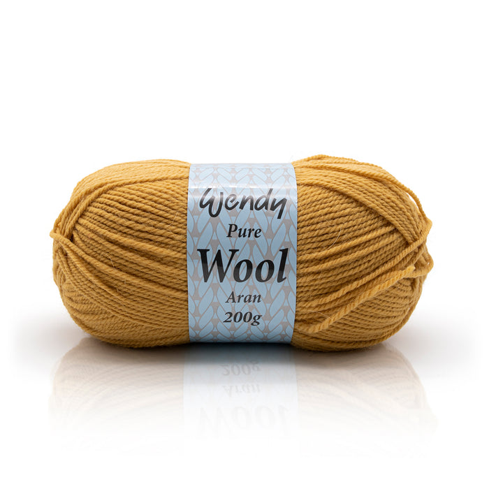 Ball of yellow yarn with a label on a white background