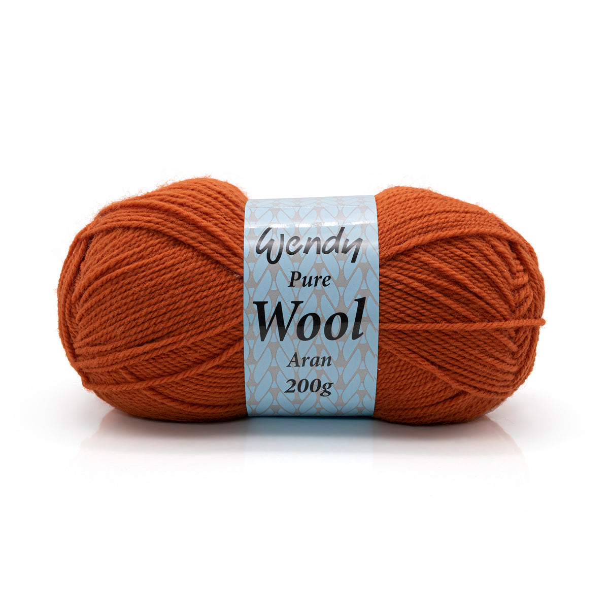 Ball of orange yarn with a label on a white background