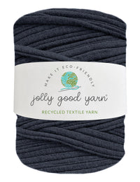 Ball of dark blue yarn with a 'jolly good yarn' label on a white background