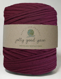 Garnet purple recycled t-shirt yarn with card label on saying Jolly Good Yarn