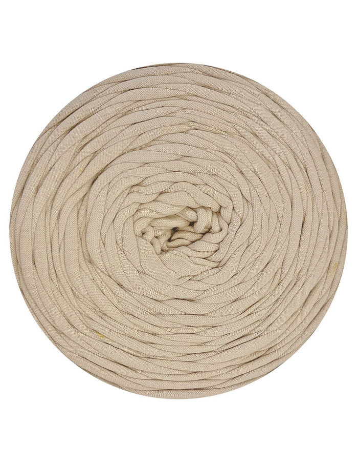 Beige yarn roll on a white background