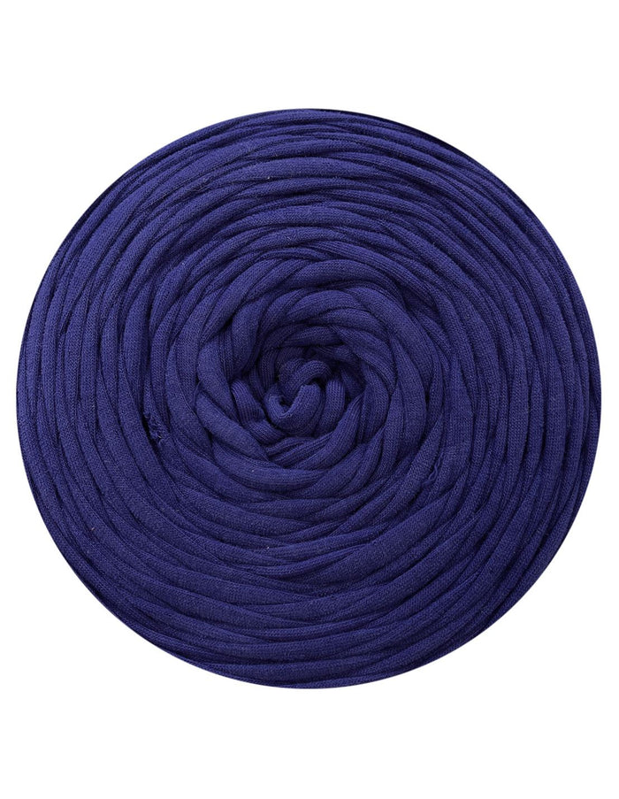 Coiled navy blue yarn on a white background
